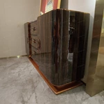 Marble-Top Sideboard Cabinet with Dark Striped Wood Veneer, Rounded Side Doors, and Central Drawer Storage